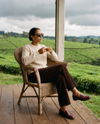 Woman with tea on a tea estate veranda in Arashi Walnut sunglasses by Kobe Afrika
