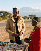 Man chatting with a Maasai beadwork seller in Atacama Walnut sunglasses by Kobe Afrika