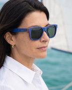Woman wearing Boracay Blue sunglasses by Kobe Afrika on a dhow, close-up