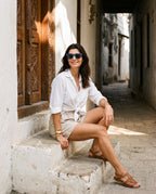 Woman on an old-town doorstep in Boracay Blue sunglasses by Kobe Afrika