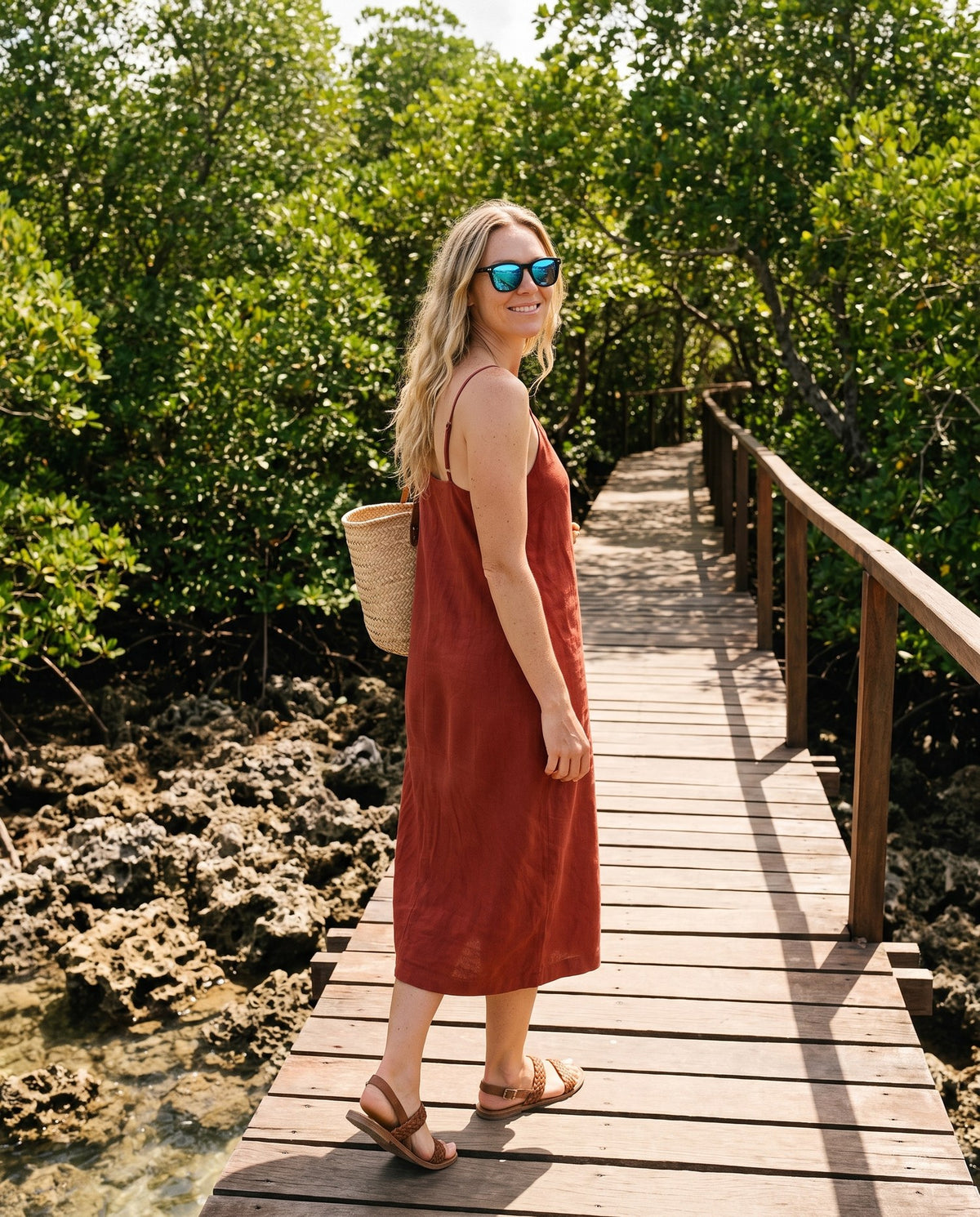 Woman on a mangrove boardwalk in Oahu Ocean sunglasses by Kobe Afrika