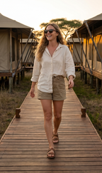 Woman on a safari lodge boardwalk in Oahu Walnut sunglasses by Kobe Afrika